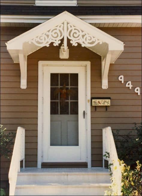 the front door of a house with white trim