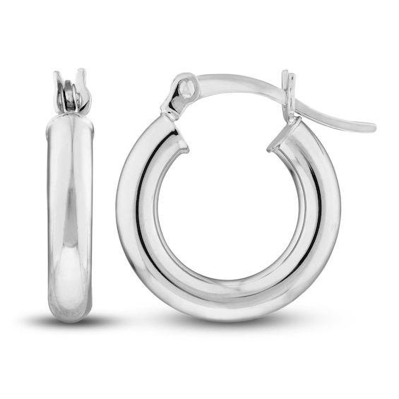 Dynamic 15mm hollow round tubes are polished to a high shine in these classic women's hoop earrings. Fashioned in 14K white gold, the earrings secure in place with hinged backs. Classic Huggie Earrings With Spring Ring Clasp For Anniversary, Classic White Gold Huggie Earrings, Classic Round Huggie Earrings, Classic Huggie Earrings, Classic Sterling Silver Huggie Earrings With Spring Ring Clasp, Classic Small Hoop Huggie Earrings With Polished Finish, Formal Round Hinged Huggie Earrings, Elegant Round Huggie Earrings With Sterling Silver Clasp, Sterling Silver Clasp Round Huggie Earrings