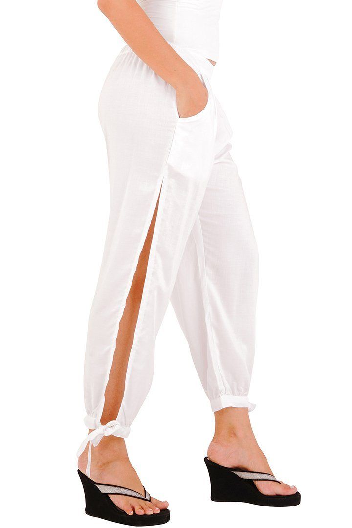 Shu-Shi women's summer harem pants feature a comfortable, lightweight style, that is both classy, yet sexy. The pants can be used as bikini cover-ups and can easily transition from daytime to nighttime by adding heels. Sexy side slits Side pockets 100% Rayon Machine wash cold water Summer Harem Pants With Pockets, White Harem Pants For Yoga In Summer, Summer Harem Yoga Pants For Loungewear, Spring Harem Yoga Pants, Stretch Harem Pants For Beach, Summer Harem Pants With Pockets For Loungewear, Solid Relaxed Fit Harem Pants For Beach, Beach Harem Bottoms With Pockets, Relaxed Fit Ankle-length Harem Pants For Vacation