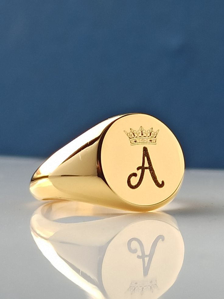 This product is GUARANTEED for life. * Rings are made with 10K-14K-18K Solid Gold. *The ring has the stamp of My Brand and 10K-14K-18K. *It can be combined with the color stone you want. * If you have another model in mind, I'd be happy to do it. * All items in my store can be made in 10K-14K-18K Solid gold. You can contact me for this. * The back of the ring is solid. * Your personalized ring comes in a beautiful gift ring box, ready to gift. * It is completely handmade. *Ring is Free on Side A Luxury Gold Engraved Ring With Hallmarks, Luxury Formal Initial Ring With Hallmarks, Luxury Hallmarked Initial Ring For Formal Occasions, Luxury Round Signet Ring With Hallmarks, Luxury Engraved Ring With Polished Finish For Gift, Luxury Engraved Ring With Polished Finish As Gift, Timeless Gold Signet Ring Gift, Timeless Polished Initial Ring As Gift, Luxury Oval Initial Ring As Gift