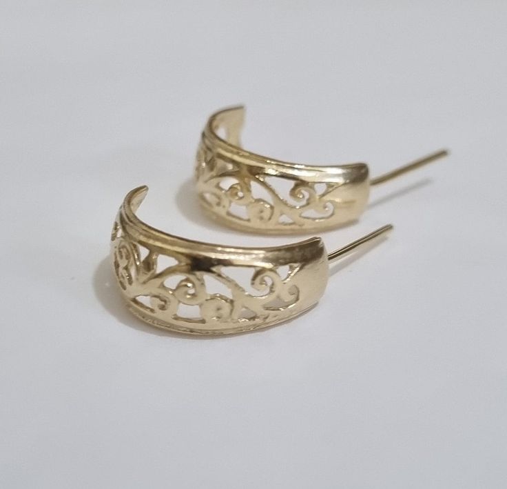 "Open hoop stud earrings in a delicate filigree design, romantic dainty jewelry bridal earrings for women, available in 14K gold plating, Sterling silver, 9k and 14k solid yellow gold. These handmade earrings have a delicate and romantic filigree design. They are available in high-quality 14K gold plating, Sterling silver, 9k or 14k yellow gold.  These gold hoop earrings are elegant, lightweight, and versatile for both everyday wear and special occasions. They would also make perfect romantic bridal earrings. Get this unique hoop earring set and add chic to your style.  Item details: 2 hoop earrings, 2 silicon backs. Dimensions: Diameter: 0.66\" (1.7 cm). Maximum width: 0.23\"-0.31\" (6-8mm). Materials: High-quality 14K gold plating / Sterling silver / 9k solid yellow gold / 14k solid yell Small Hoop Filigree Earrings As Gift, Small Hoop Earrings With Intricate Design As Gift, Small Filigree Hoop Earrings As Gift, Small Hoop Earrings For Wedding, Small Hoop Pierced Earrings For Wedding, White Gold Pierced Hoop Earrings For Wedding, Intricate Design Hoop Earrings For Wedding, Filigree Round Hoop Earrings For Anniversary, Round Filigree Hoop Earrings For Anniversary