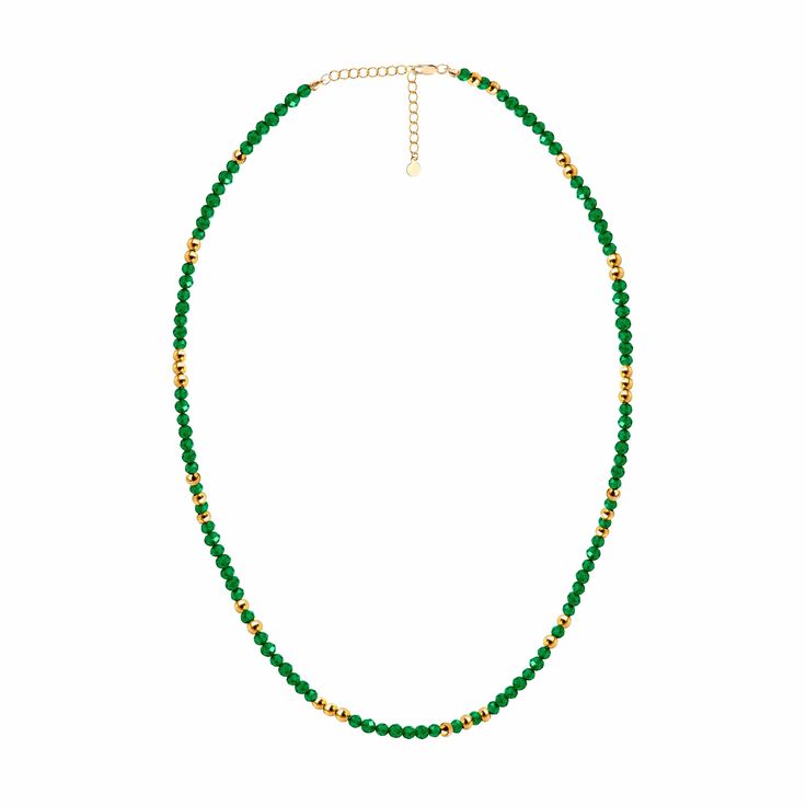 The Auren green onyx necklace features 3.00 mm natural green onyx beads in a mesmerising emerald green colour. It is available in 14 ct gold filled. This beautiful necklace can be worn on its own to add a bit of colour and sparkle to your outfit, stacked with other gemstone necklaces for a bohemian look, or simply incorporated into your favourite stack. It is also an excellent gift for those born in May. Beads: approx. 3.00 mm green onyx beads, 2.5 mm 14 ct gold filled beads. Finish: 14 ct. gold-filled Length: Adjustable length Options Available 40/45 cm; 45/50 cm; 50/55 cm; 55/60 cm Gemstone: Green Onyx is a variety of chalcedony dyed rich green colour. Packaging: Our jewellery arrives in beautiful letterbox-friendly packaging made from sustainable FSC® certified materials. All items come Emerald Green Colour, Green Onyx Necklace, Uk Brands, Gemstone Necklaces, Onyx Necklace, Bohemian Look, Rich Green, Necklace Beaded, Onyx Bead