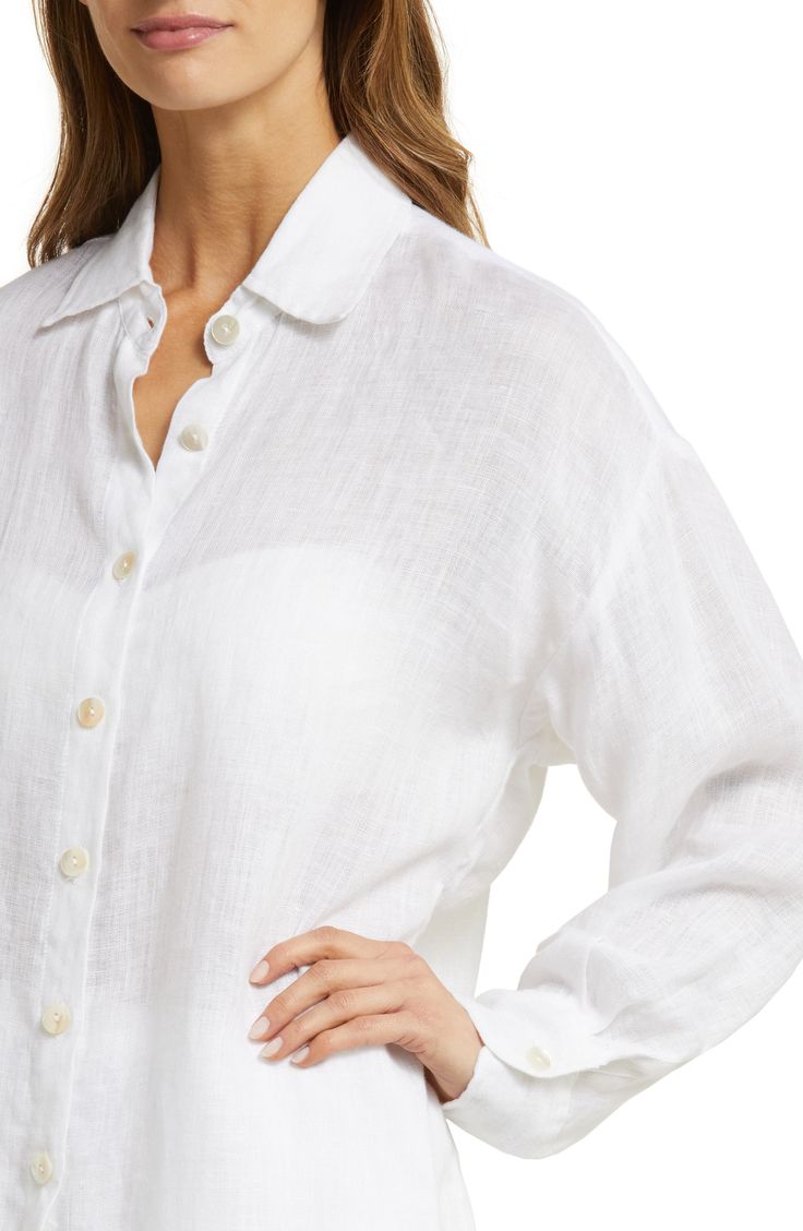 This oversized cover-up shirt woven from lightweight linen is a must-pack companion for your next sunny getaway. 32 1/2" length (size Medium)   Front button closure   Spread collar   Long sleeves with button cuffs   Curved high-low hem   100% linen   Hand wash, dry flat   Imported   As a member of 1% for the Planet, Vitamin A has committed to donating 1% of its annual sales to nonprofit partners in support of environmental solutions Vacation Linen Long Sleeve Shirt, Long Sleeve Linen Shirt For Vacation, Oversized Linen Beach Shirt, Chic Linen Shirt For Vacation, Chic Linen Beach Shirt, Chic Linen Shirt For Beach, Chic Linen Shirt For The Beach, Classic Linen Tops For Beach, Classic Linen Tops For The Beach