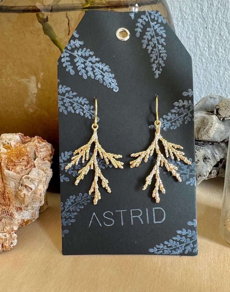 your new favorite autumn & winter earrings! These earrings start with two gold-plated ear wires, and each feature a gold-filled cypress frond.  Bᵊrôš means "cypress, fir, juniper and/or pine" in Hebrew! These are considered "noble" trees.  Bᵊrôš Drops -- gold-filled and gold-plated components, cypress cedar coniferous leaf evergreen, Torah keeper, statutes commandments Yeshua YHWH messianic God Nature-inspired Nickel-free Gold Earrings, Nature-inspired Gold Nickel-free Earrings, Handmade Gold Christmas Earrings, Handmade Gold Earrings For Christmas, Nature-inspired Gold Earrings With Ear Wire, Nature-inspired Gold Earrings, Gold Leaf-shaped Earrings For Gift, Gold Leaf Earrings For Gift, Hypoallergenic Gold Nature-inspired Jewelry