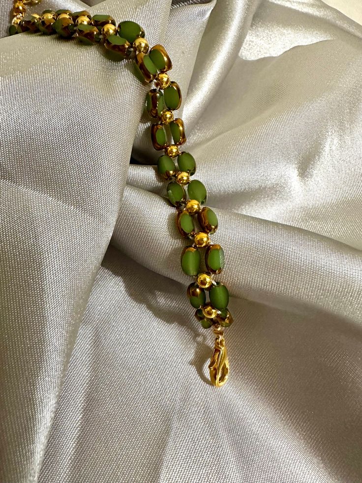 Our delicate bracelet is very suitable for daily wear.It can be also be given to girlfriends,daughters,mothers,stepmom,or as a birthday gifts to friends.  🦋Main materials :  Green beads,3mm 14k gold plated round beads 🦋My bracelets is about 6-7 inches without extension chain so they can be suitable for most people's wrist,and if you had big wrist,still no problem with 2.5 inches extension  🦋About packaging: Our bracelet is packaged in a simple white box. 🦋About shipping: we ships the order next day, If you have any question,please feel free to contact me. 🦋Thank you for visiting my shop, I hope you enjoy your jewelry as much as we enjoy making it for you. Please visit my shop page for many more exciting items. Check back frequently as new designs are added regularly.    https://assali Bohemian Single Strand Gold Beaded Bracelet, Gold Single Strand Spiritual Bracelet, Green Jade Bracelet For Wedding, Jade Bracelets With Spacer Beads As Gift, Adjustable Single Strand Green Beaded Bracelets, Adjustable Green Single Strand Beaded Bracelets, Hand-strung Jade Bracelets In Gold, Hand-strung Gold Jade Bracelets, Green Spiritual Jewelry With Tiny Beads