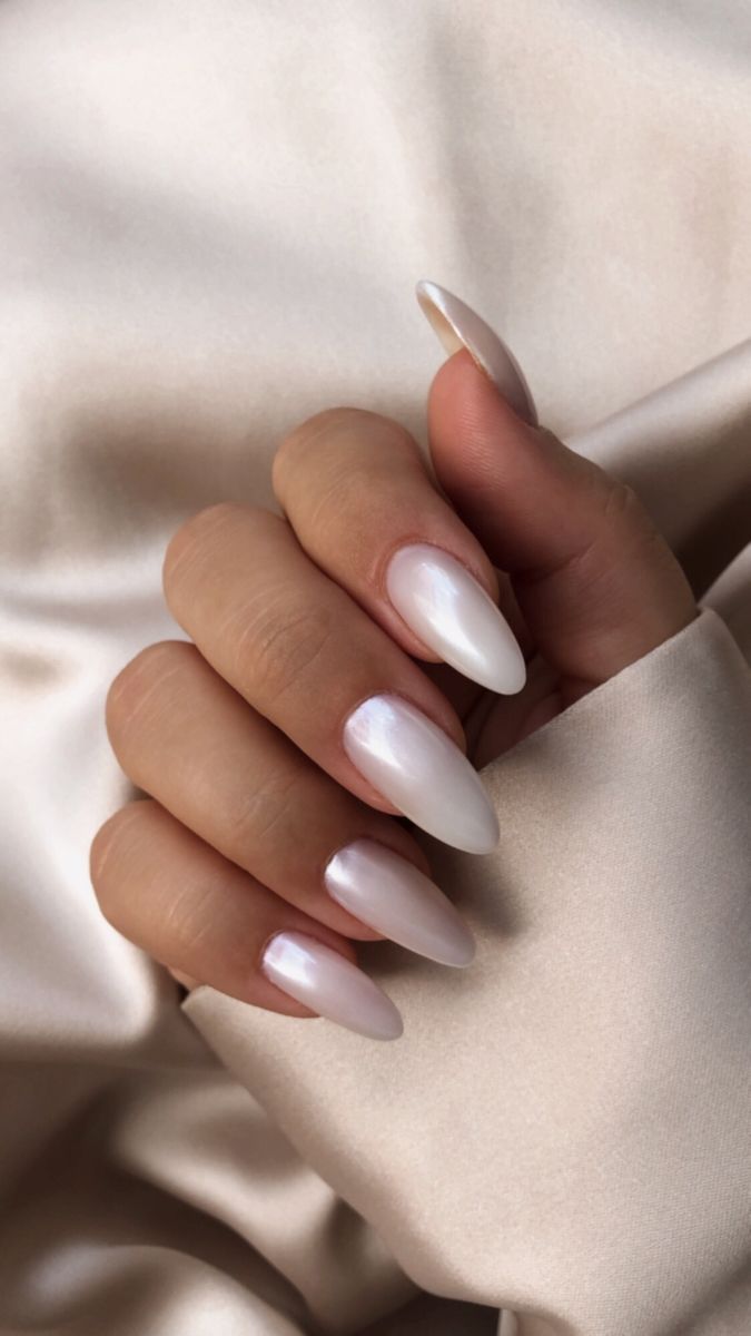 nails | hailey bieber | chrome | nailart | inspired | white | mandel | white nails | chrome nails | mandel nails | long nails | milky white | nail goals | nail 2022 White Chrome Nails Designs Almond, Haily Biber White Nails, Milky White Nails Shimmer, White Oval Nails With Designs, Peal White Nails, White Pearl Nails By Skin Tone Range, Shimmery White Almond Nails, Milky White Pearl Chrome Nails, Hailey Bieber Milky White Nails