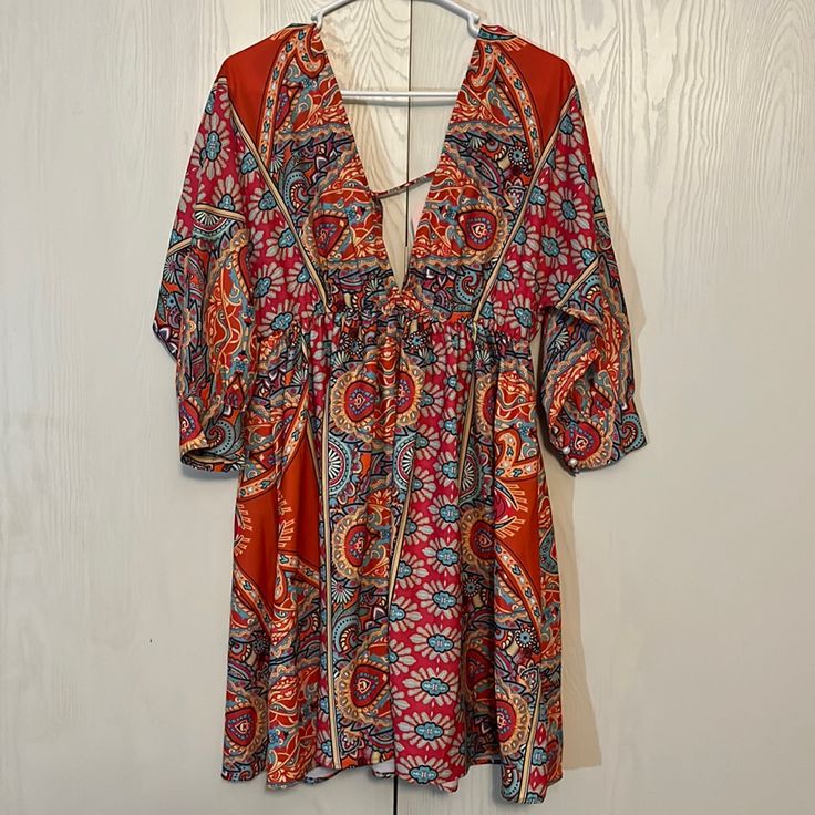 Nwt Boho Deep V Neck Dress Multi Color Paisley Print 3/4 Sleeves Elastic Empire Waist Tie Back Full Skirt 100% Polyester Unbranded Shoulder To Hem 34” Pit To Pit 21” Size L Stunning Colors! Beautiful! Orange Summer Dress With 3/4 Sleeve, Summer Orange Dress With 3/4 Sleeves, Orange 3/4 Sleeve Summer Dress, Orange Half Sleeve Summer Dress, Casual Orange Half Sleeve Dress, Flowy Orange Mini Dress For Beach, Bohemian V-neck Mini Dress With Vibrant Print, Orange V-neck Mini Dress For Vacation, Orange Mini Dress With Vibrant Print For Beach