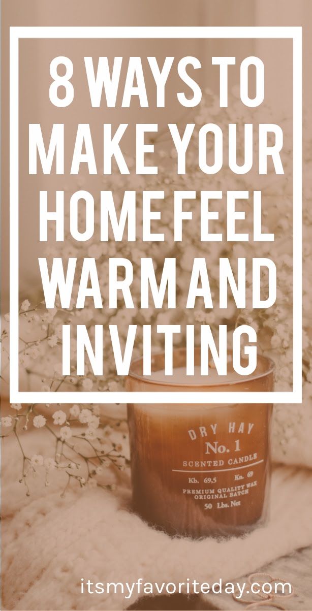 a candle with the words 8 ways to make your home feel warm and inviting on it