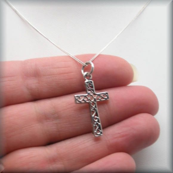 "A lovely sterling silver cross has the added interest of a scrollwork pattern added to the center sections. Wonderful for everyday wear for someone who wants a necklace of faith. The pendant is 1\" long (2.54 cm). The bail adds about 1/4\" more in length. Both pendant and curb chain are sterling silver. Items are shown larger in pictures to show detail - please note the dimensions. Jewelry is packaged in a cotton lined box for gift-giving. See more Bonny Jewelry at http://bonnyjewelry.etsy.com Sterling Silver Cross Pendant For First Communion, Silver Cross Pendant Jewelry For First Communion, Sterling Silver Cross Pendant Necklace For First Communion, Sterling Silver Cross Necklace For First Communion, Silver Cross Pendant Jewelry For Baptism, Silver Cross Jewelry For Confirmation, Sterling Silver Necklace For First Communion, Engraved Cross Jewelry For First Communion, Engraved Cross Necklace For First Communion