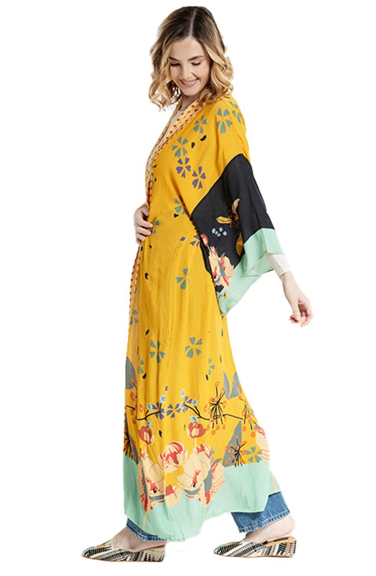 Hit the beach or kick it poolside in this flowy kaftan that features an allover floral pattern, kimono-inspired sleeves and an open-front silhouette. Kimono-inspired sleeves 100% rayon Hand wash, line dry Imported Multicolor Kimono Beach Cover-up, Spring V-neck Beachwear Kimono, Yellow Kaftan For Beach Cover-up, Spring V-neck Beachwear Kaftan, Summer V-neck Beachwear Robe, Spring V-neck Kaftan For Beachwear, Bohemian Yellow Kimono Beach Cover-up, Yellow Bohemian Kimono For Beach Cover-up, Spring Floral Print V-neck Kaftan