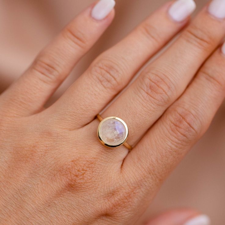 Moonstone Ring 14K Gold - Rainbow Moonstone Natural Gemstone Ring for Women - Anniversary Birthday Valentine's Gold Gift for Her 14K gold rainbow moonstone ring. A gorgeous moonstone ring, ideal for every woman who loves elegant style. An excellent choice for anniversary gift for her. The gemstone is natural and conflict-free mined. 100% handcrafted with love! PRODUCT DETAILS ● Material: 14K solid gold, white gold, rose gold ● Gemstone: Moonstone, briolette cut ● Stone Diameter: 8mm (0.3in) or 1 Delicate Moonstone Ring With Rose Cut Diamonds, Modern 14k Yellow Gold Moonstone Ring, Delicate 14k Gold Moonstone Ring, Modern Yellow Gold Round Moonstone Ring, Gold Moonstone Ring With Natural Stones For Anniversary, Elegant 14k Gold Moonstone Ring, Elegant 14k Gold Moonstone Ring With Round Cut, Gift Birthstone Ring With Rose Cut Diamonds, Elegant Yellow Gold Moonstone Ring With Round Stone