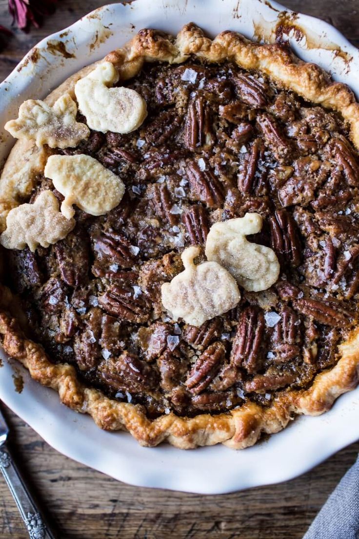 a pecan pie with nuts and crackers on top