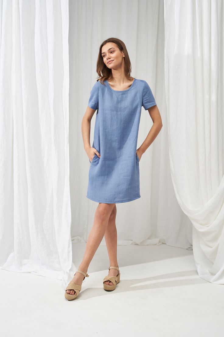 "A classic, fitted design shirt dress that is super comfy and stylish at the same time. Tailored with short sleeves, made from Lithuanian washed linen fabric. Feels silky soft on the skin and is a nice item to pair with both sandals and sneakers. FABRIC: 100% Softened Lithuanian Linen COLOR: Please choose the desired color from the side menu. STYLE: Loose linen T-shirt dress with short sleeves, fold at the back, and side pockets. SIZE CHART: 2 US/ 6 AU/ 34 EU: Bust 31.5\" (80 cm) , Waist 23\" (5 Casual T-shirt Dress For Summer Workwear, Cotton Short Sleeve Dress, Knee-length, Relaxed Fit, Knee-length Cotton Short Sleeve Dress With Relaxed Fit, Relaxed Fit Short Sleeve Dress, Relaxed Fit Cotton Short Sleeve Knee-length Dress, Relaxed Fit Knee-length Short Sleeve Dress For Daywear, Relaxed Fit Linen Work Dress, Short Sleeve Linen Dress With Pockets For Work, Fitted Short Sleeve Linen Dress For Work