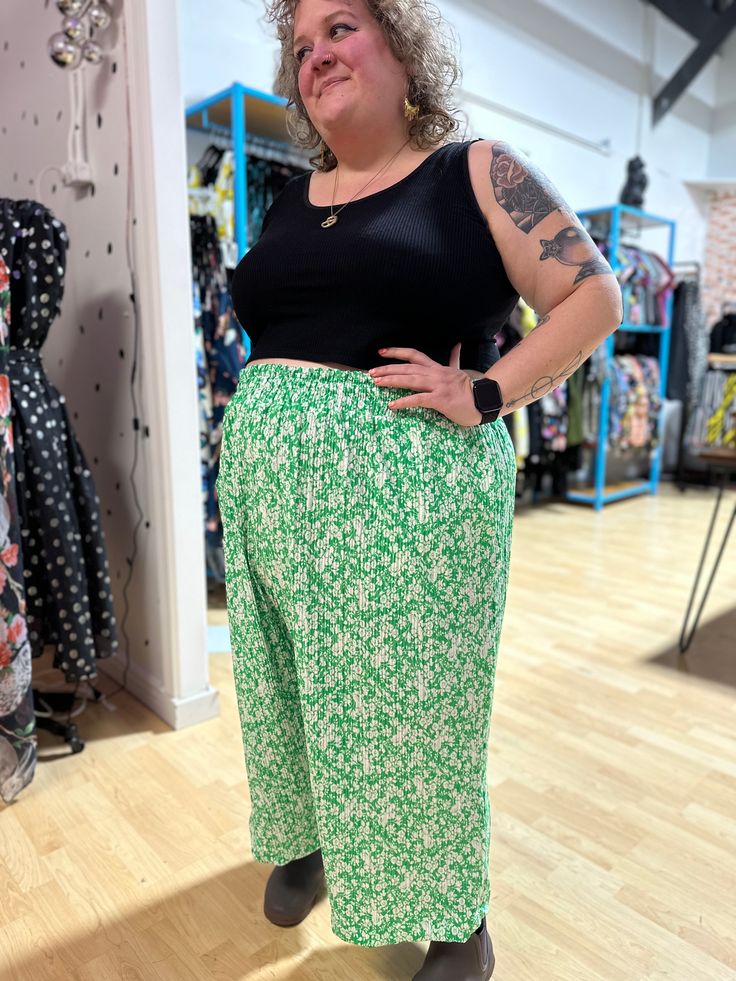 You guys loved the first iterations of these fun pleated Elyse Pants so here we are again with a super fun green and white floral options! Cut in our Elyse pant style these are a statement and also super comfy with a wide elastic waistband and POCKETS. *These cuties are made to order so please allow a little extra time for shipping- approximately 2-3 weeks from order date.* Green Floral Print Wide-leg Pants, Green Stretch Pants For Day Out, Green Relaxed Fit Pants For Day Out, Green Floral Print Bottoms For Day Out, Spring Green Harem Pants, Spring Floral Print Ankle-length Harem Pants, Spring Green Harem Pants With Elastic Waistband, Green Harem Pants With Elastic Waistband For Spring, Green Ankle-length Pants For Spring