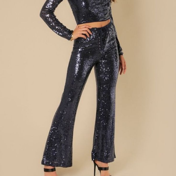 These Blue Sequin Pants Are The Party Pants You've Been Waiting For! Our "Sequins Pants” Are Navy Blue And Have A Great Fit Which Makes Them Perfect To Wear With Slim Fit Shirts And Over-Sized Tees. The Dazzling Sequined Fabric Makes For A Glamorous Look, With The Sheen Of The Sequins Gleaming With Movement From The Pants. Glamorous Wide Leg Bottoms With Contrast Sequin, Glamorous Wide-leg Bottoms With Contrast Sequin, Glamorous Fall Bottoms With Contrast Sequin, Glamorous Contrast Sequin Bottoms For Party Season, Glamorous Evening Pants With Contrast Sequin, Contrast Sequin Wide Leg Pants For Party Season, Wide Leg Pants With Contrast Sequin For Night Out, Wide Leg Sequin Pants For Night Out, Wide Leg Pants With Contrast Sequin For Party Season