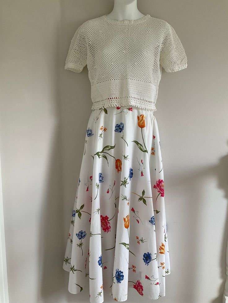 Laura Ashley skirt, vintage skirt, 90's skirt, full circle skirt, white skirt, summer skirt, midaxi skirt, floral skirt, 90's clothing Lovely 90's vintage floral ladies skirt by Laura Ashley - extremely rare Gorgeous crisp white cotton skirt, with single stem floral design in lovely vibrant colours.  Full circle skirt with fixed waist band and flat zip fastening at the back.  Lovely long skirt which hangs beautifully when worn. Made by Laura Ashley in the 1990's  In lovely preloved vintage condi Summer Floral Print Voluminous Maxi Skirt, Floral Print Voluminous Maxi Skirt For Summer, Voluminous Floral Print Maxi Skirt For Summer, Floral Print Full Maxi Skirt With Voluminous Fit, Voluminous Floral Print Full Maxi Skirt, Floral Print Full Maxi Skirt, White Fitted Skirt For Garden Party, Fitted White Skirt For Garden Party, Spring Floral Print Full Maxi Skirt