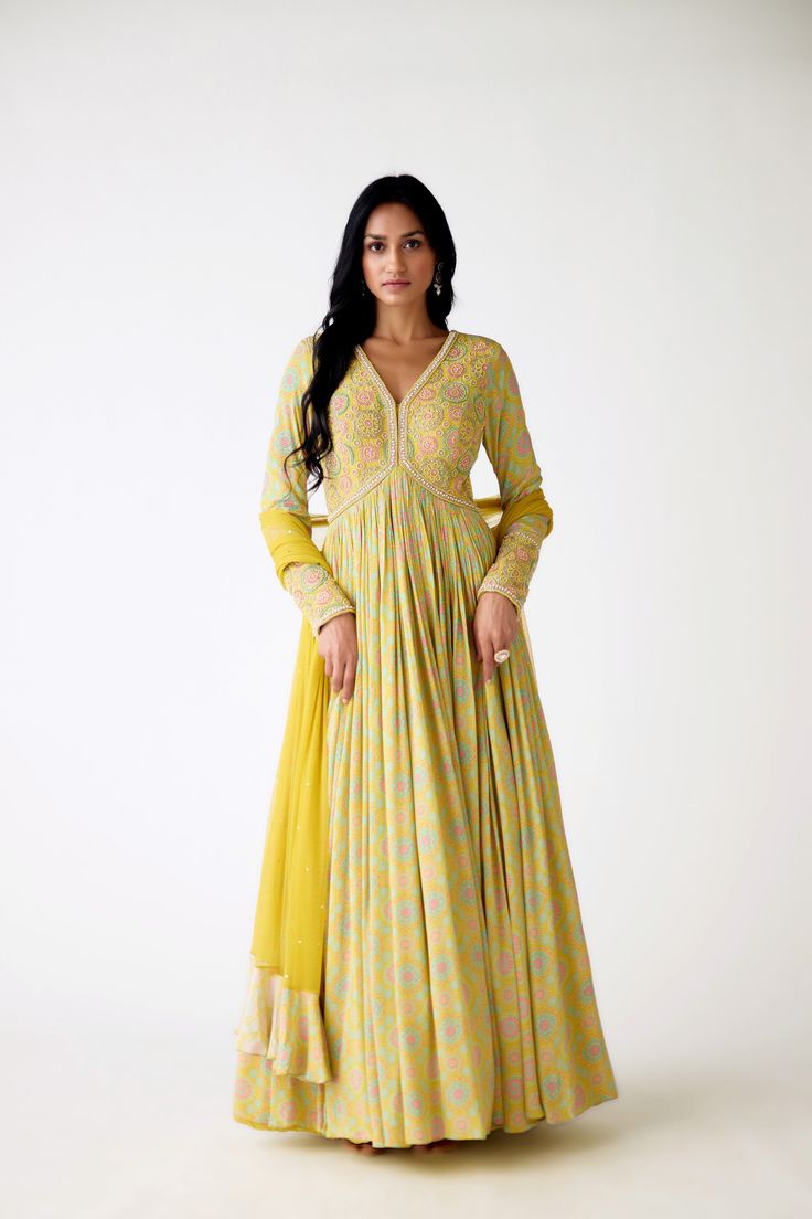 Stunning yellow printed beads and sequin work crepe Anarkali is a perfect festive wear. It comes with a matching dupatta. Shop online from Pure Elegance. Disclaimer: The actual product may vary slightly from the image. These are custom orders, hence expect slight variation in color and placement of the motif or buta. ESTIMATED DELIVERYBecause this is a custom order, it would take about 4 weeks from the date of purchase. RETURN POLICYThis product is a custom order and cannot be returned or exchanged. Sharara Suits, Fashion Journals, Pure Elegance, Festive Wear, Anarkali Suit, Traditional Fabric, Yellow Print, Designer Sarees, Blouse Dress