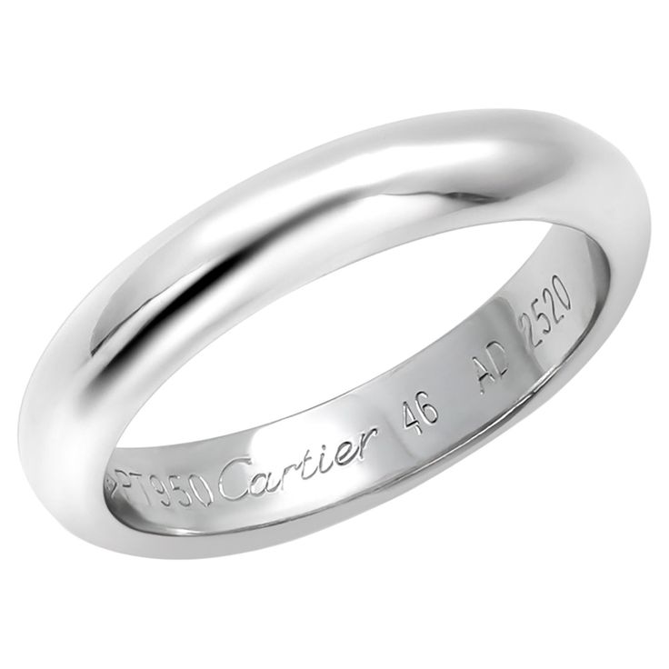 The Cartier 1985 Platinum Wedding Band is a beautiful and timeless piece of jewelry that features a classic design and high-quality materials. The band is made from platinum, which is one of the most durable and precious metals used in jewelry making. Finger size 5 plus. This particular ring is a size 5.25 and is signed by Cartier, indicating that it was made by the luxury French jewelry brand. The ring was created in 1985, which adds to its vintage appeal and makes it a unique and special piece Cartier 1985 Wedding Band, Timeless Polished Cartier Rings, Classic Timeless Round Band Jewelry, Classic Jewelry With Timeless Design For Anniversary, Classic White Gold Jewelry With Polished Finish, Classic White Gold Jewelry For Anniversary, Classic Timeless Jewelry For Anniversary, Classic Design White Gold Wedding Jewelry, Classic White Gold Wedding Jewelry