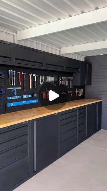 a garage with lots of cabinets and tools