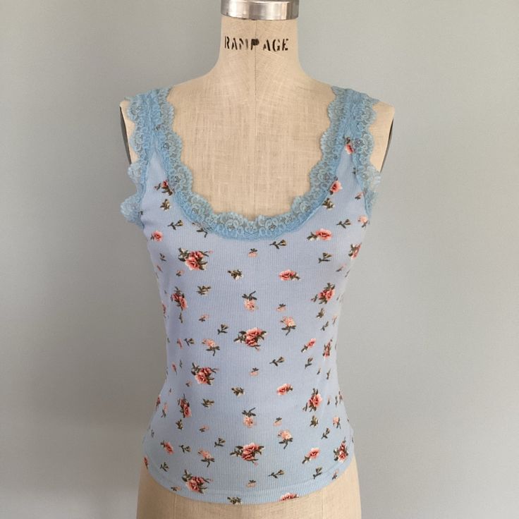 Rue21 Floral Tank Top With Lace Trim Size Large Nwt Excellent Condition Preowned New Approximate Measurements Laying Flat In Photos 93% Polyester 7% Spandex Blue Feminine Tops With Lace Trim, Sleeveless Light Blue Floral Print Top, Blue Floral Print Cami Top, Light Blue Cotton Tops With Lace Trim, Blue Lace Trim Tank Top For Spring, Blue Casual Tops With Lace Trim, Casual Blue Tops With Lace Trim, Fitted Light Blue Floral Print Tops, Blue Floral Print Cotton Tank Top