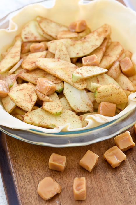 apple slices and caramel chunks in a bowl