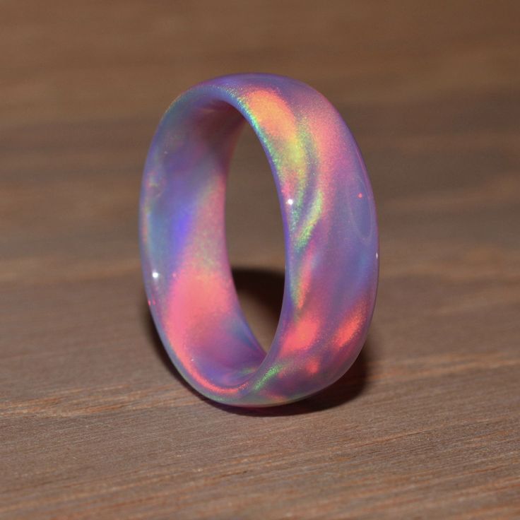 Nebula Opal, or Oparex, is a heat-hardened resin with a mixture of silica. Different from lab-grown synthetic opal with high silica percentage, it only contains 25% silica. We can create this ring in almost any color you desire, simply add a note in the cart at checkout and we will find the customization right for you. HOW RINGS ARE MADE Each ring is custom cut using a diamond bit and lapped to your ring size using a lathe and jeweler's mandrill, the inside and outside of the ring are sanded and Gothic Viking, Magical Jewelry, Synthetic Opal, Dope Jewelry, Funky Jewelry, Girly Jewelry, Opal Ring, Dream Jewelry, Pretty Jewellery