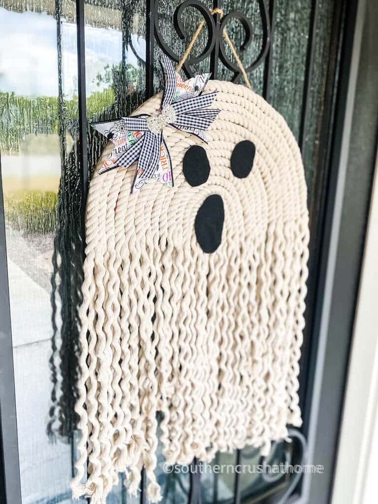 a door hanger that has been made to look like a ghost