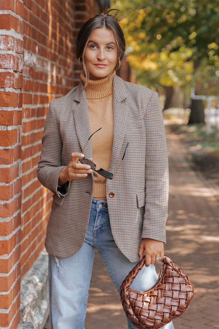 The Boss Babe Oversized Plaid Blazer is a must-have for any stylish professional! With its long sleeves, buttoned cuffs, and notched collar, this blazer exudes confidence and power. The oversized fit and allover plaid pattern add a touch of trendy flair. Made from high-quality materials, this blazer will keep you comfortable and stylish all day long. Layer it over a basic tank top or bodysuit and then pair with jeans, ankle booties, and a matching crossbody bag for an elevated boho chic look! Spring Workwear Sport Coat Button-up, Spring Button-up Sport Coat For Workwear, Oversized Business Casual Blazer With Button Closure, Trendy Notch Lapel Outerwear For Office, Oversized Blazer For Business Casual With Button Closure, Trendy Office Outerwear With Notch Lapel, Oversized Notch Lapel Blazer For Business Casual, Trendy Notch Lapel Business Outerwear, Trendy Business Outerwear With Notch Lapel