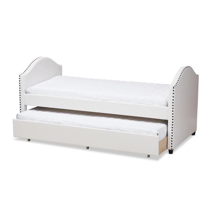 a white daybed with trundle and mattresses on the bottom bunk bed