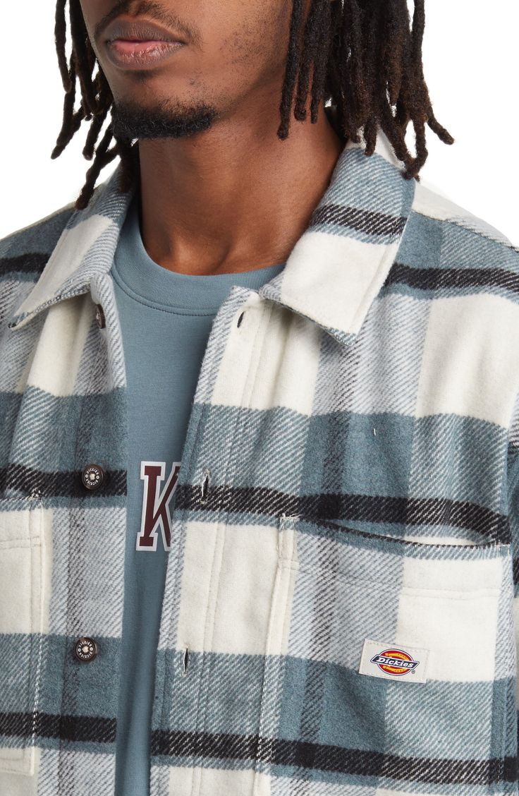 Midweight flannel woven in a bold plaid brings casual, relaxed comfort to an overshirt crafted with a touch of wool and a fit that's easy to layer in the cold. 29 1/2" length; 44" chest (size Medium) Spread collar Long sleeves with button cuffs 65% polyethelene, 20% wool, 15% other fibers Dry clean Imported Casual Wool Shacket For Fall, Casual Plaid Wool Outerwear, Casual Wool Flannel Button-up Shirt, Wool Flannel Button-up Shirt For Fall, Wool Button-up Flannel Shirt For Fall, Fall Wool Button-up Flannel Shirt, Collared Flannel Shirt For Fall Streetwear, Casual Wool Button-up Tops, Casual Wool Flannel Shirt For Fall