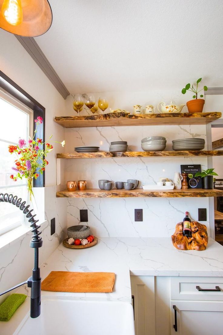 the kitchen is clean and ready to be used for cooking or baking, while also being used as a dining area