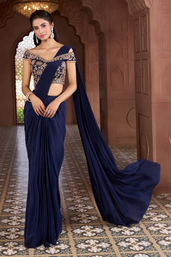 Navy blue pre-draped saree. Comes with floral and geometric embroidered off-shoulder blouse. - Aza Fashions Embellished Unstitched Pre-draped Saree, Evening Pre-draped Anarkali Saree With Zari Work, Evening Saree Choli For Eid, Evening Pre-draped Saree For Navratri, Evening Traditional Wear With Pallu For Navratri, Navratri Evening Traditional Wear With Pallu, Art Silk Pre-draped Saree For Navratri Evening, Anarkali Art Silk Saree For Evening, Evening Pre-draped Saree In Art Silk With Pallu