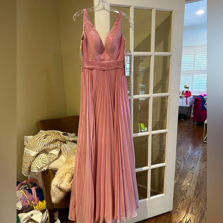 Selling This Beautiful Dress Never Worn !!!! Pleated V-neck Gown For Party, Pink Pleated Dress For Prom Season, Pink Formal Dress With Pleated Bodice, Formal Pink Dress With Pleated Bodice, Pink Formal Dress With Lined Bodice, Elegant Lined Evening Dress For Prom, Pink Pleated Evening Dress For Formal Occasions, Formal Pink Pleated Evening Dress, Pink Lined Prom Dress