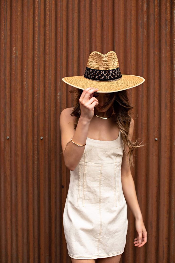 Our Palm Desert Panama fit in perfectly on our latest road trip photo shoot. Stunning, classic, chic - everything you've ever wanted in a hat. Featuring a molded crown with a pinched 10cm brim and hand woven straw, it's crystallized on the tone on tone ribbon with a simple Swarovski rivet. -Rancher style hat with a chill & casual vibe-Brim is flexible but holds its shape-Coordinating ribbon band-Pinched top-Great quality-- will last forever-This color actually goes with everything effortless Chic Straw Panama Hat With Curved Brim, Chic Toquilla Straw Panama Hat With Wide Brim, Chic Wide Brim Panama Hat In Toquilla Straw, Chic Curved Brim Travel Hat, Structured Crown Panama Hat For Spring Vacation, Elegant Straw Hat For Spring Picnic, Chic Straw Fedora Panama Hat, Adjustable Toquilla Straw Sun Hat With Structured Crown, Chic Straw Fedora With Curved Brim