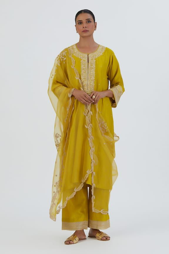 Lime yellow three fourth flared sleeves straight kurta in silk base with blossom embroideries on the yoke, sleeves hem and ditsy buttis detailing spluttered all over. Paired with a matching embroidered border palazzo. - Aza Fashions Elegant Yellow Salwar Kameez For Spring, Elegant Yellow Dupatta For Spring, Spring Yellow Silk Dupatta, Elegant Yellow Kurta With Dabka, Elegant Yellow Palazzo Set With Resham Embroidery, Elegant Yellow Kurta With Dabka Work, Elegant Yellow Festive Palazzo Set, Elegant Festive Yellow Palazzo Set, Yellow Slub Silk Palazzo Set With Straight Kurta