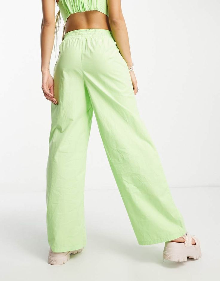 Pants by Signature 8 Part of a co-ord set Top sold separately High rise Elasticized waistband Side pockets Relaxed fit Green Wide Leg Pants With Side Pockets, Green Relaxed Fit Parachute Pants With Elastic Waistband, Green Parachute Pants With Relaxed Fit And Elastic Waistband, Green Parachute Pants With Elastic Waistband, Relaxed Fit, Green High-waisted Parachute Pants For Work, Green Wide Leg Pants With Elastic Waistband, Green Wide-leg Parachute Pants, Green Pants With Side Pockets For Spring, Spring Green Pants With Side Pockets