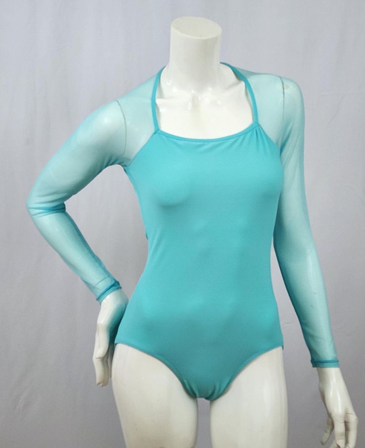 Square Halter Neckline - Aquamarine base milliskin fabric - Aquamarine stretch mesh sleeves - Open deep scoop neck back This listing includes USPS First Class Shipping throughout the US. Additional shipping charges apply to international orders. Solid Color Dance Unitard With Thumbholes, Stretch Nylon Bodysuit With Sheer Sleeves, Stretch Mesh Bodysuit With Sheer Sleeves, Sheer Stretch Long Sleeve Bodysuit, Sheer Long Sleeve Stretch Bodysuit, Stretch Mesh Long Sleeve Bodysuit, Spring Fitted Bodysuit With Mesh Sleeves, Fitted Bodysuit With Mesh Sleeves For Spring, Summer Long Sleeve Mesh Bodysuit