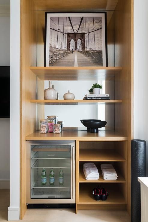 an empty shelf in the corner of a room