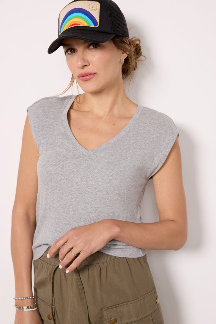 A strong shoulder design takes this Michael Stars tee up a notch, crafted in soft rib knit fabric with a v-neckline and semi-relaxed fit. Paired with skirts, jeans, or shorts, it will be your new favorite staple. Cotton V-neck Top With Ribbed Neckline, Trendy V-neck Top With Ribbed Neckline, Stretch V-neck Tops With Ribbed Neckline, Casual V-neck Tank Top For Everyday, Casual Relaxed Fit V-neck Top For Loungewear, Casual V-neck Tank Top For Loungewear, Basic V-neck Loungewear Tops, Casual Stretch V-neck Top For Everyday, Casual V-neck Loungewear Top