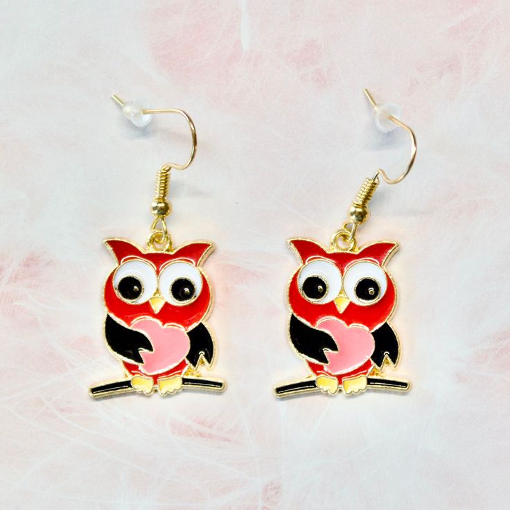 Add a pop of whimsy and love to your earring collection with our Owl Earrings in TWO STYLES: Red Owl Earrings and Pink Owl Earrings. Measuring 1 1/2 inches, the metal design is durable and eye-catching, while the hooks are lead-free and nickel-free for comfortable wear. Add some fun to your everyday look with our Owl Earrings. ---Shipping Information--- ✦ Processing time: 3-5 days ✦ Shipping profile: Please check according to the destination. If you have any questions about our products or would Cute Single Earring For Valentine's Day, Cute Single Earring Jewelry For Valentine's Day, Playful Red Dangle Jewelry, Playful Red Drop Earrings, Playful Red Pierced Earrings, Playful Red Earrings For Pierced Ears, Playful Jewelry Set With Drop Earrings, Playful Jewelry Set With Matching Drop Earrings, Red Whimsical Nickel-free Earrings