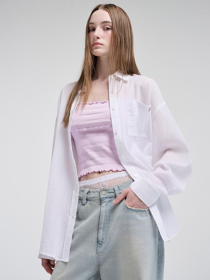 This product blends casual comfort with unique detailing, presenting an Oversized Pocket Summer Shirt that's both stylish and versatile. The relaxed fit offers a breezy option for warm days, while the large pocket detail adds a functional yet fashionable touch. Its oversized nature makes it a perfect layering piece or a standalone statement item. - Designed with an oversized fit for a relaxed and comfortable feel, ideal for the summer season.- Features a large front pocket that combines practicality with a stylish edge.- The shirt comes with a soft, breathable fabric that ensures comfort even on the hottest days.- Subtle branding elements give it a distinct identity without overpowering the simple elegance of the shirt. Summer Blouse With Pockets For Everyday Wear, White Tops With Pockets For Casual Gatherings, Casual Blouse With Pockets For Day Out, Oversized Casual Blouse With Pockets, Casual Oversized Blouse With Pockets, Relaxed Blouse With Pockets For Spring, Relaxed Spring Blouse With Pockets, Effortless Tops With Pockets For Daywear, Daywear Tops With Pockets And Shirttail Hem