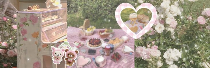 there is a table with cupcakes and cakes on it in front of flowers