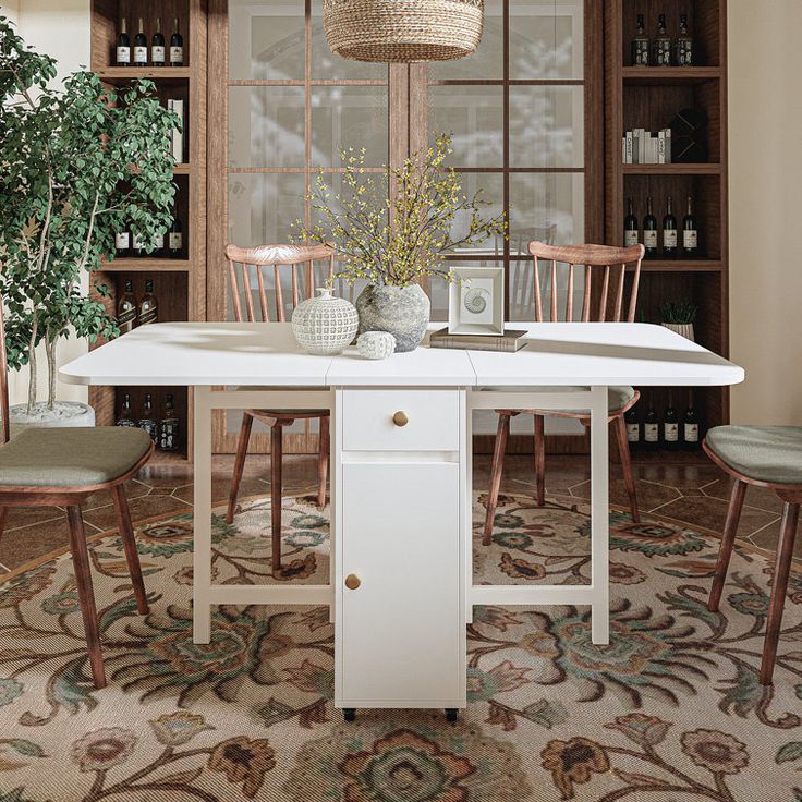 a dining room table with chairs and vases on it in front of a window