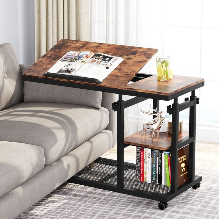 a living room with a couch, coffee table and bookshelf on the floor