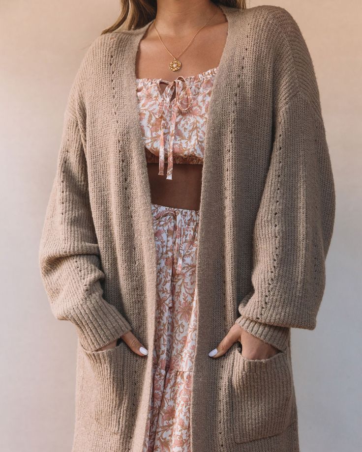 Beige Stretch Knit Cardigan, Open Knit Cardigan For Fall Loungewear, Spring Textured Knit Cardigan For Loungewear, Long Sleeve Open Knit Cardigan For Loungewear, Cozy Stretch Beige Outerwear, Cozy Beige Stretch Outerwear, Brown Spring Cardigan For Loungewear, Brown Cardigan For Spring Loungewear, Textured Knit Outerwear For Spring Loungewear