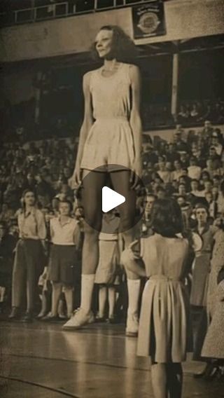 an old photo of a woman standing on a basketball court with other people in the background