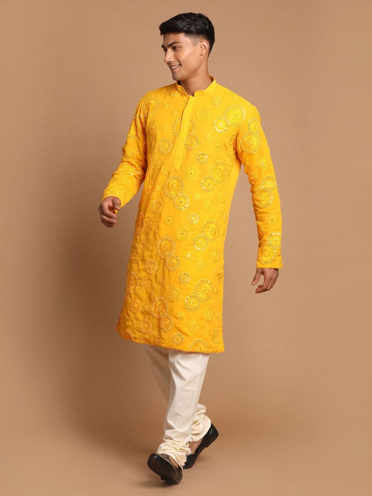 SHRESTHA BY VASTRAMAY Men's Yellow Embroidered Kurta Pyjama Set Look dapper in this ethnic set featuring a yellow kurta with intricate embroidery and a comfortable pyjama. Made with high-quality fabric, this set is perfect for festive occasions or a touch of tradition in your everyday wear. Key Features Embroidered kurta Comfortable pyjama Yellow color Specifications: Sleeve Length - Long Sleeves Top Shape Straight Top Hemline - Straight Top Length - Knee Length Neck Mandarin collar Top- Pattern Yellow Kurta With Chikankari Embroidery For Diwali, Festive Yellow Kurta With Chikankari Embroidery, Yellow Festive Kurta With Chikankari Embroidery, Eid Yellow Kurta With Chikankari Embroidery, Yellow Kurta With Chikankari Embroidery For Festivals, Yellow Long Sleeve Kurta With Chikankari Embroidery, Yellow Chikankari Embroidered Kurta For Festivals, Yellow Chikankari Kurta For Festivals, Long Sleeve Yellow Kurta For Transitional Season