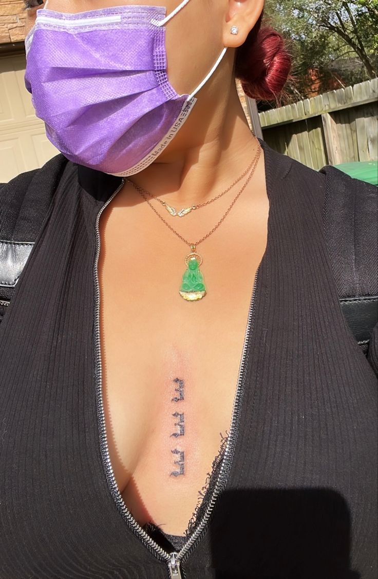 a woman wearing a face mask with the word free on her chest