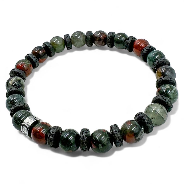 Description Unleash your inner adventurer with the Lava Rock & Gemstone Beaded Bracelet from our Atlas Collection. This striking bracelet features a captivating combination of handmade mossy green bloodstone and black lava stone beads, creating a bold and unique statement for the discerning gentleman. Highlights Handmade Excellence: Meticulously crafted in Knoxville Tennessee, ensuring each bracelet is a unique masterpiece. Premium Bloodstone and Lava Stone Beads: Naturally formed and carefully Adjustable Green Moss Agate Bracelet, Casual Green Agate Bracelet, Casual Green Agate Bracelets, Casual Lava Stone Bracelet With Natural Stones, Casual Hand-strung Lava Stone Bracelets, Green Moss Agate Bracelet With Natural Stones, Casual Green Stretch Bracelet With Natural Stones, Mala Beads Bracelet, Mossy Green