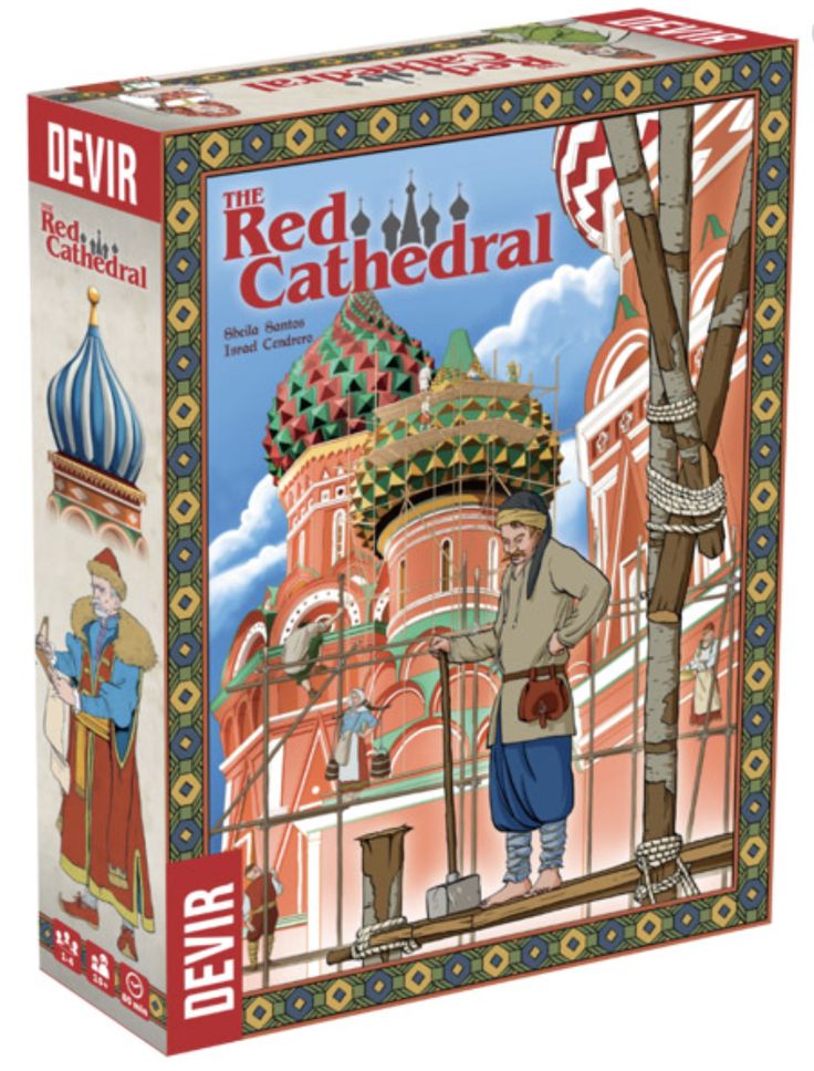 the red cathedral jigsaw puzzle box is open and showing an image of a man standing